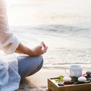 mindfulness and meditation practice outdoors with crystals, tea and journal - spiritual coaching image