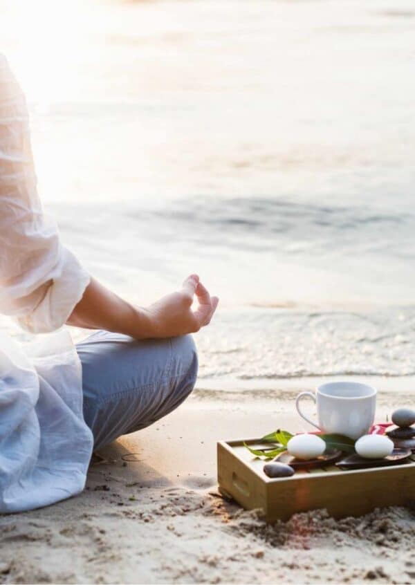 mindfulness and meditation practice outdoors with crystals, tea and journal - spiritual coaching image